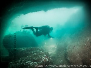 Diving through cave
